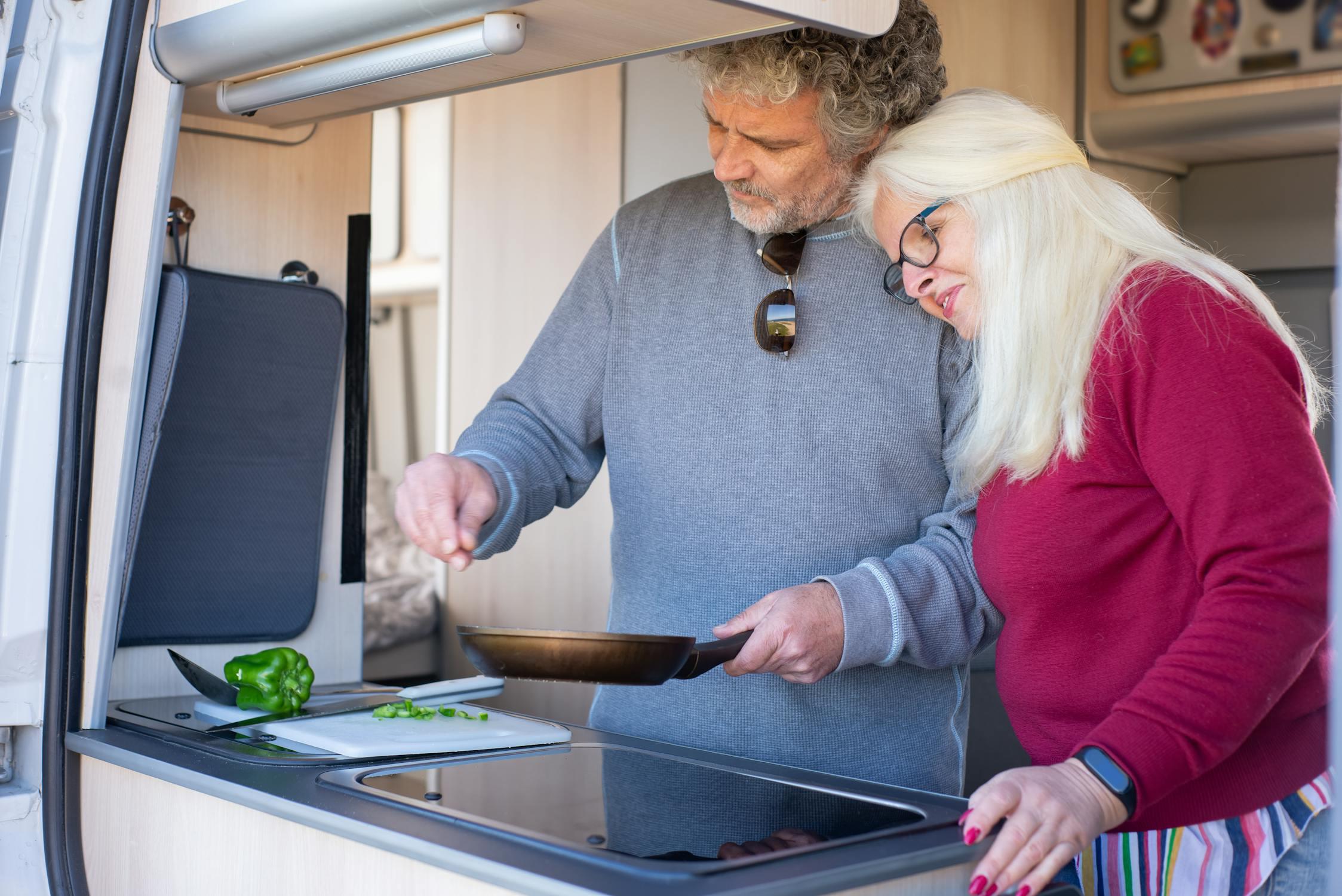 A couple preparing a healthy meal together in their kitchen.