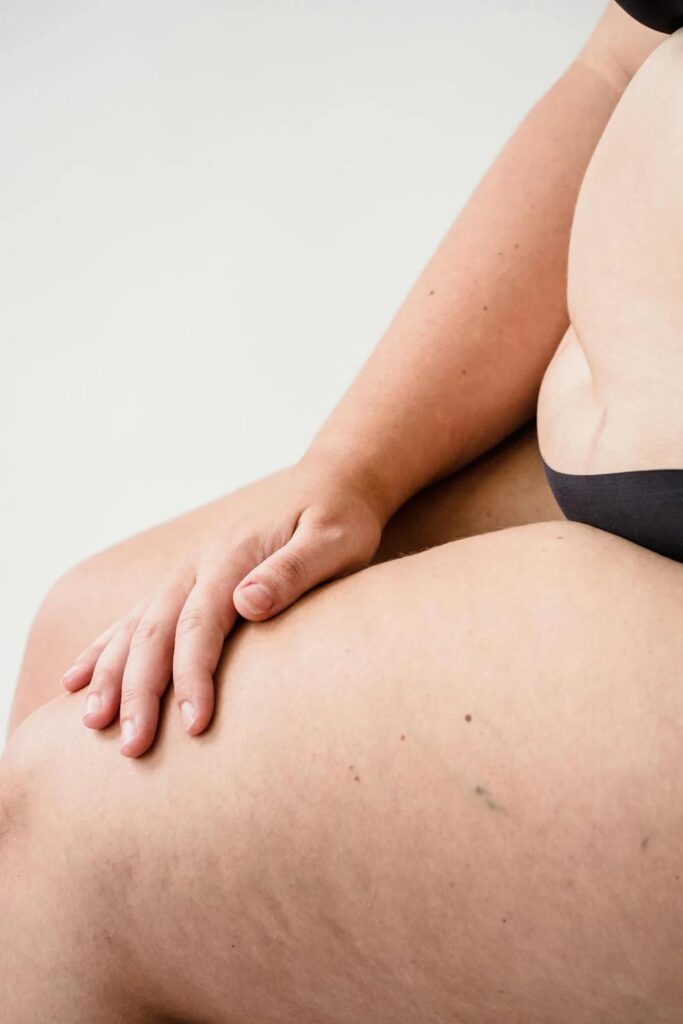 A beautiful woman posing confidently, highlighting her thighs.