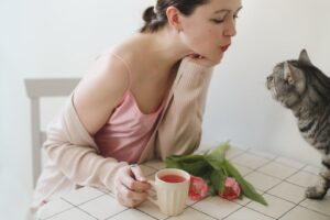 A woman drinking refreshing fruit-infused water.