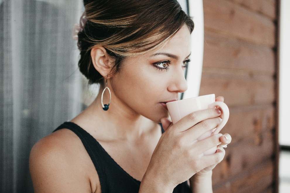 Woman drinking coffee first thing in the morning on an empty stomach