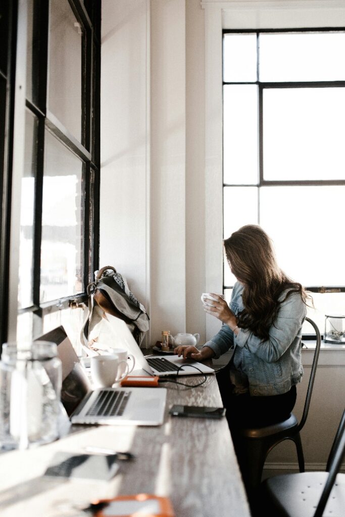 Woman starting her morning at a desk with intention and calm