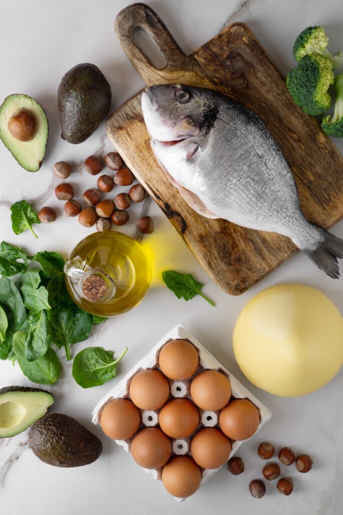 Various foods rich in omega-3 fatty acids, including fish, eggs, avocado, and nuts.