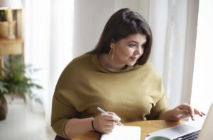 A person setting goals for a weight loss journey.