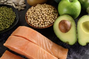 A variety of protein sources including salmon, avocado, eggs, and various legumes and nuts.
