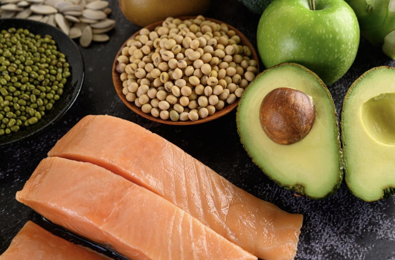 A variety of protein sources including salmon, avocado, eggs, and various legumes and nuts.